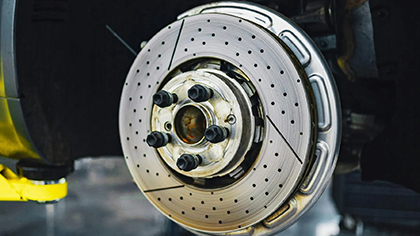 Close-up of a vehicle's brake rotor and caliper, highlighting brake repair services offered by Blackstone Complete Auto Care LLC in Columbus, OH.